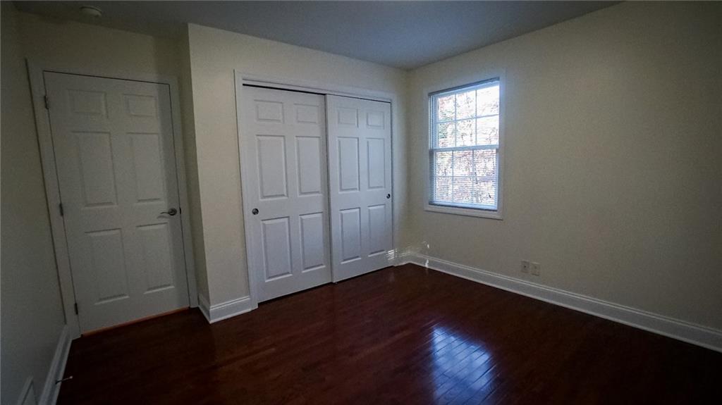 221 Old Plank Road Butler, PA 16002 - Photo 11 of 25 an empty room with wooden floor and windows