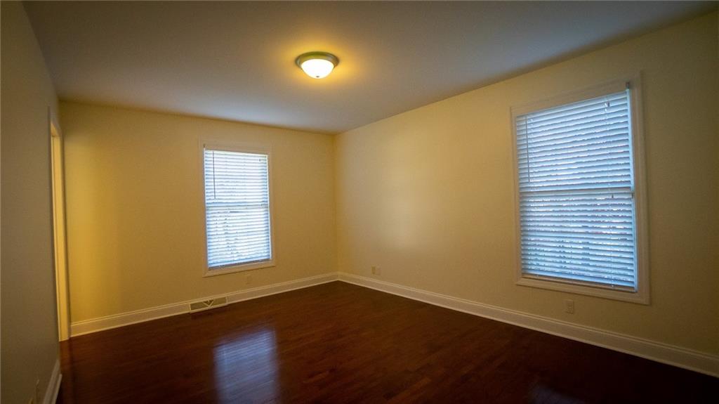 221 Old Plank Road Butler, PA 16002 - Photo 14 of 25 a view of an empty room with wooden floor and a window