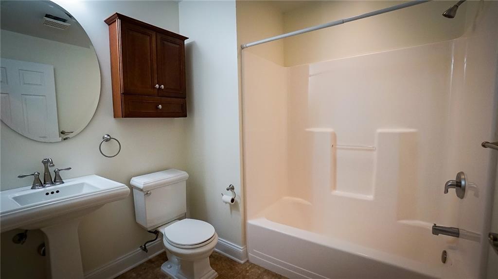 221 Old Plank Road Butler, PA 16002 - Photo 16 of 25 a white toilet sitting next to a bath tub
