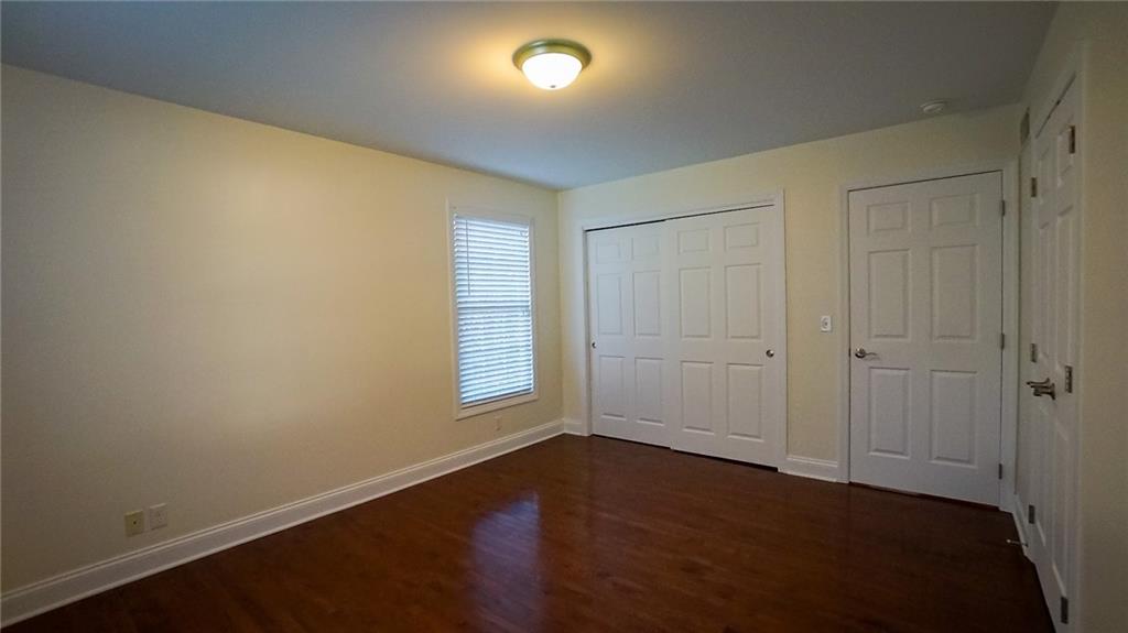 221 Old Plank Road Butler, PA 16002 - Photo 18 of 25 an empty room with wooden floor and windows