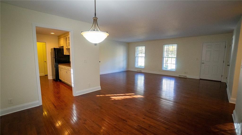 221 Old Plank Road Butler, PA 16002 - Photo 3 of 25 a view of an empty room with wooden floor and a window
