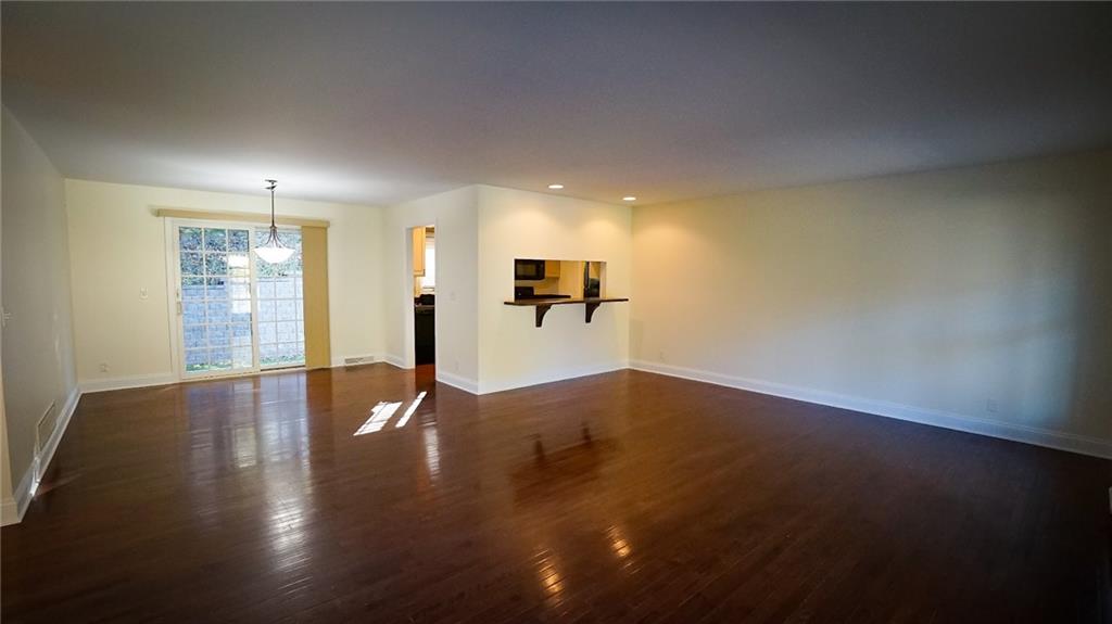 221 Old Plank Road Butler, PA 16002 - Photo 5 of 25 an empty room with wooden floor and windows