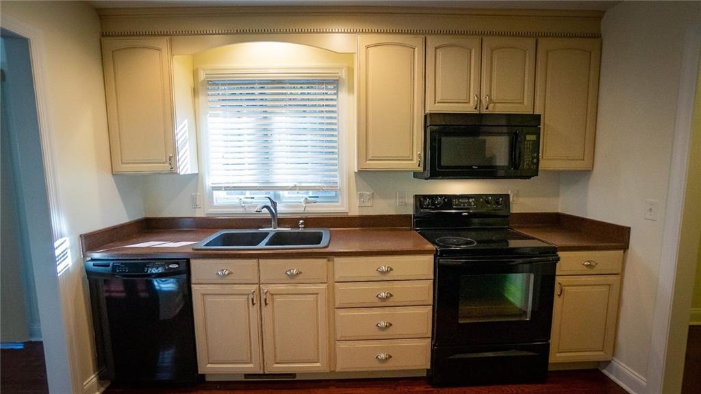221 Old Plank Road Butler, PA 16002 - Photo 8 of 25 a kitchen with granite countertop a sink and a stove