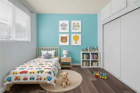 a bedroom with bed and a window