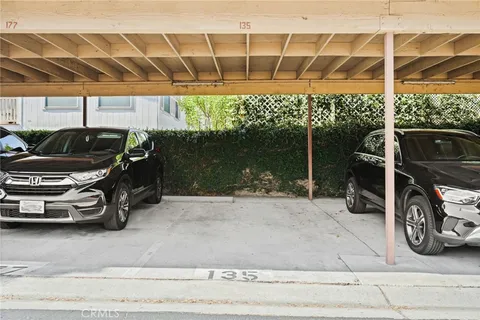 a swimming pool with outdoor seating and yard