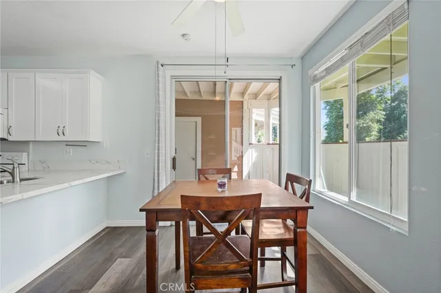 a dining room with furniture and window