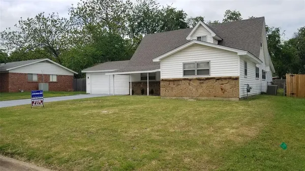a house view with a garden space
