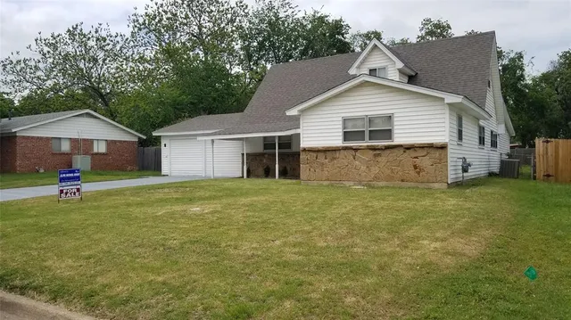 a house view with a garden space