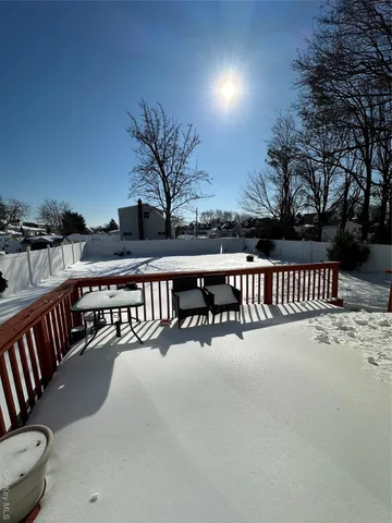 a view of a balcony with chairs