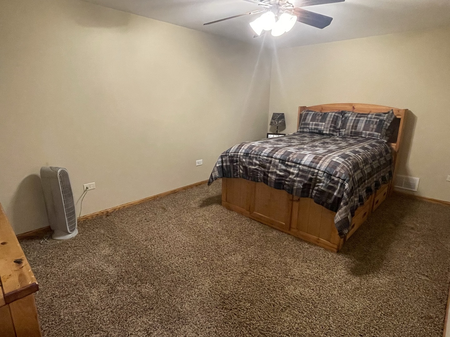 8701 South Rood Road Kingston, IL 60145 - Photo 16 of 26 a bedroom with a bed and a chair
