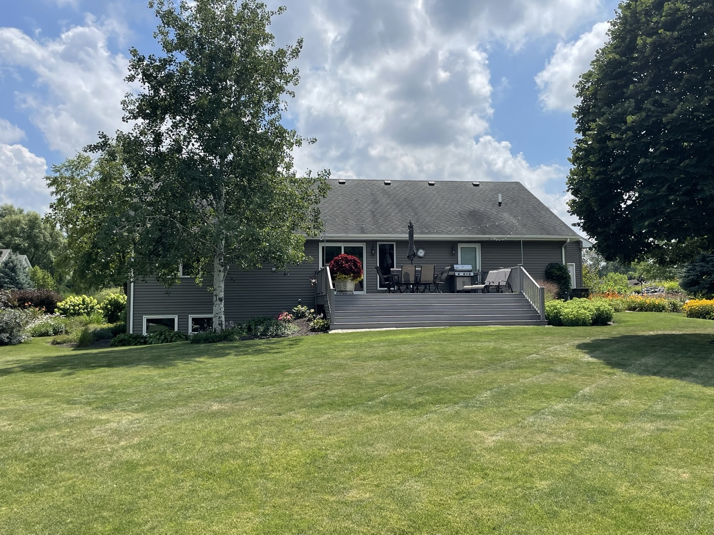 8701 South Rood Road Kingston, IL 60145 - Photo 18 of 26 a view of a house with a yard and sitting area