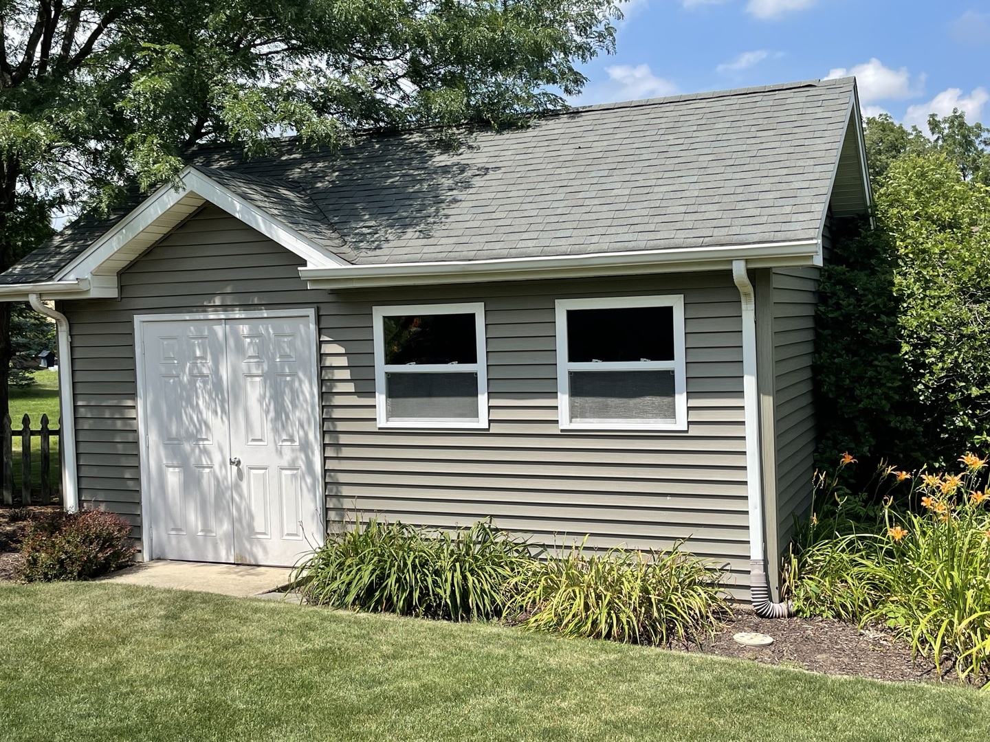 8701 South Rood Road Kingston, IL 60145 - Photo 24 of 26 a front view of a house with a yard