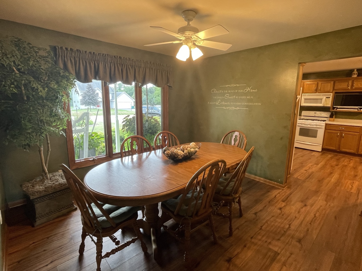 8701 South Rood Road Kingston, IL 60145 - Photo 5 of 26 a view of a dining room with furniture window and wooden floor