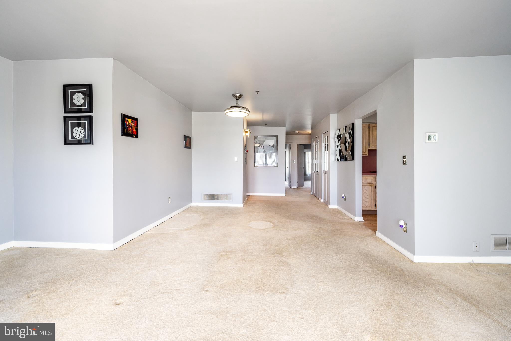 5213 Le Parc Drive, Unit 4 Wilmington, DE 19809 - Photo 17 of 37 a view of a big room with closet and chandelier fan