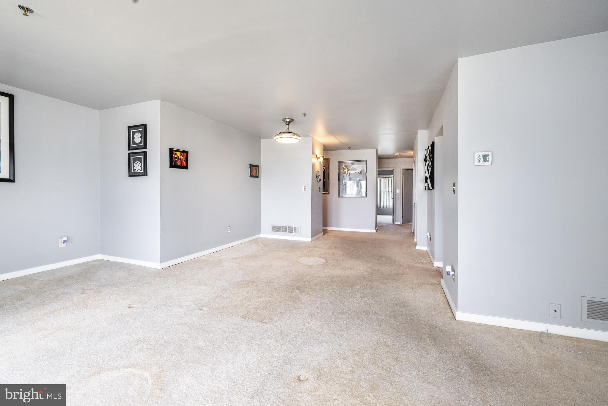 5213 Le Parc Drive, Unit 4 Wilmington, DE 19809 - Photo 19 of 37 a view of a big room with closet and chandelier fan
