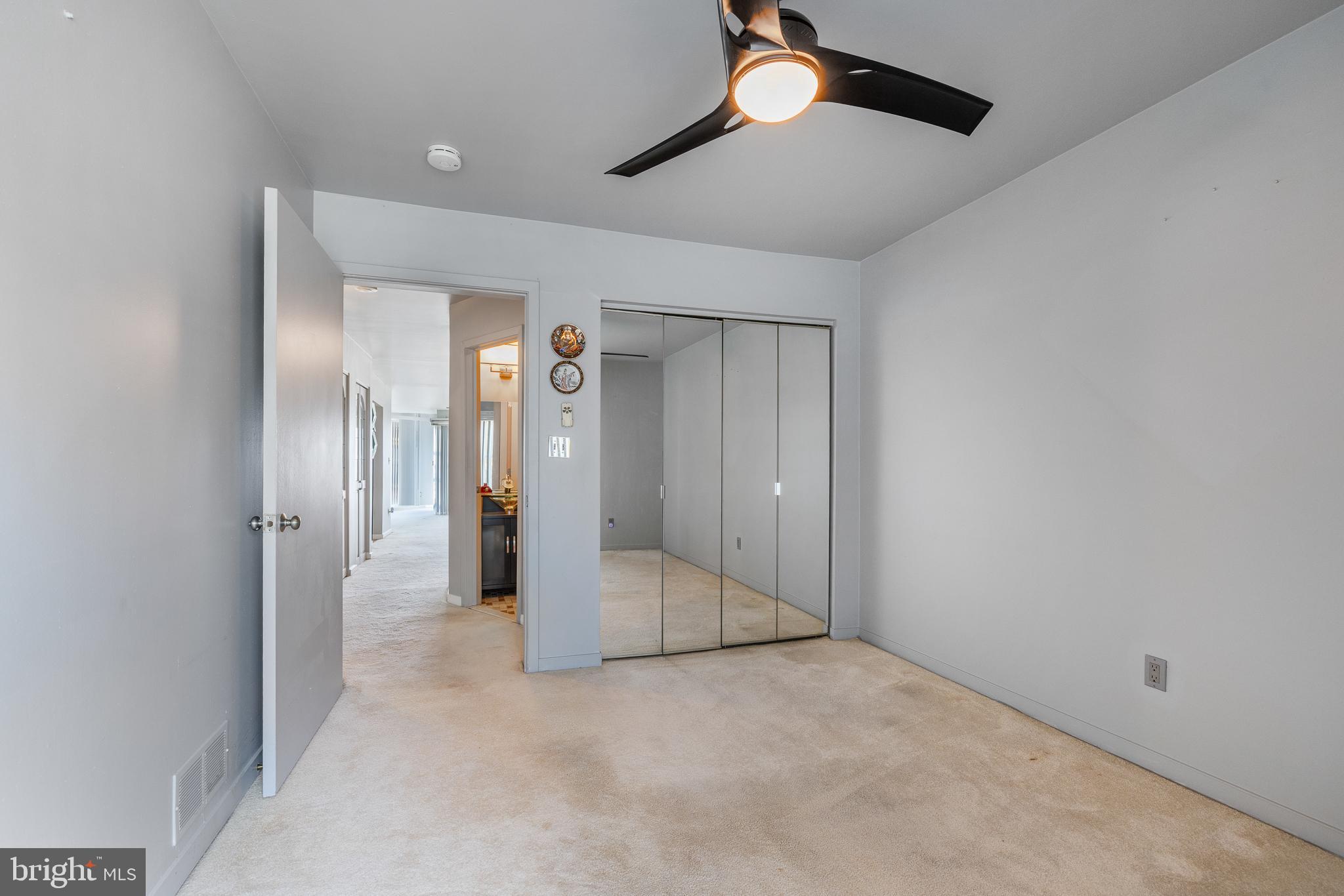 5213 Le Parc Drive, Unit 4 Wilmington, DE 19809 - Photo 28 of 37 a view of a hallway with wooden shelves