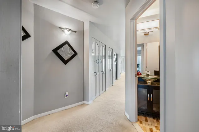 an empty room with a ceiling fan and window