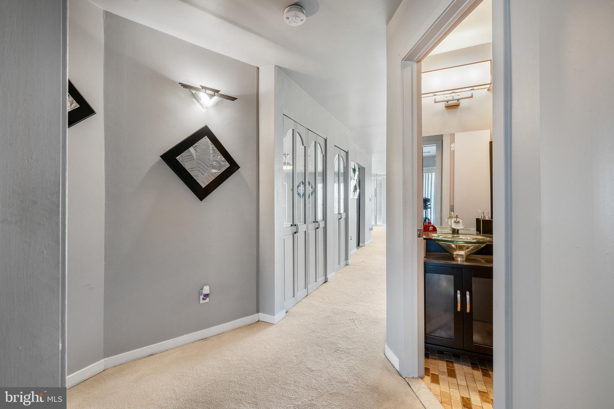 5213 Le Parc Drive, Unit 4 Wilmington, DE 19809 - Photo 29 of 37 a view of a hallway with wooden floor and dining room