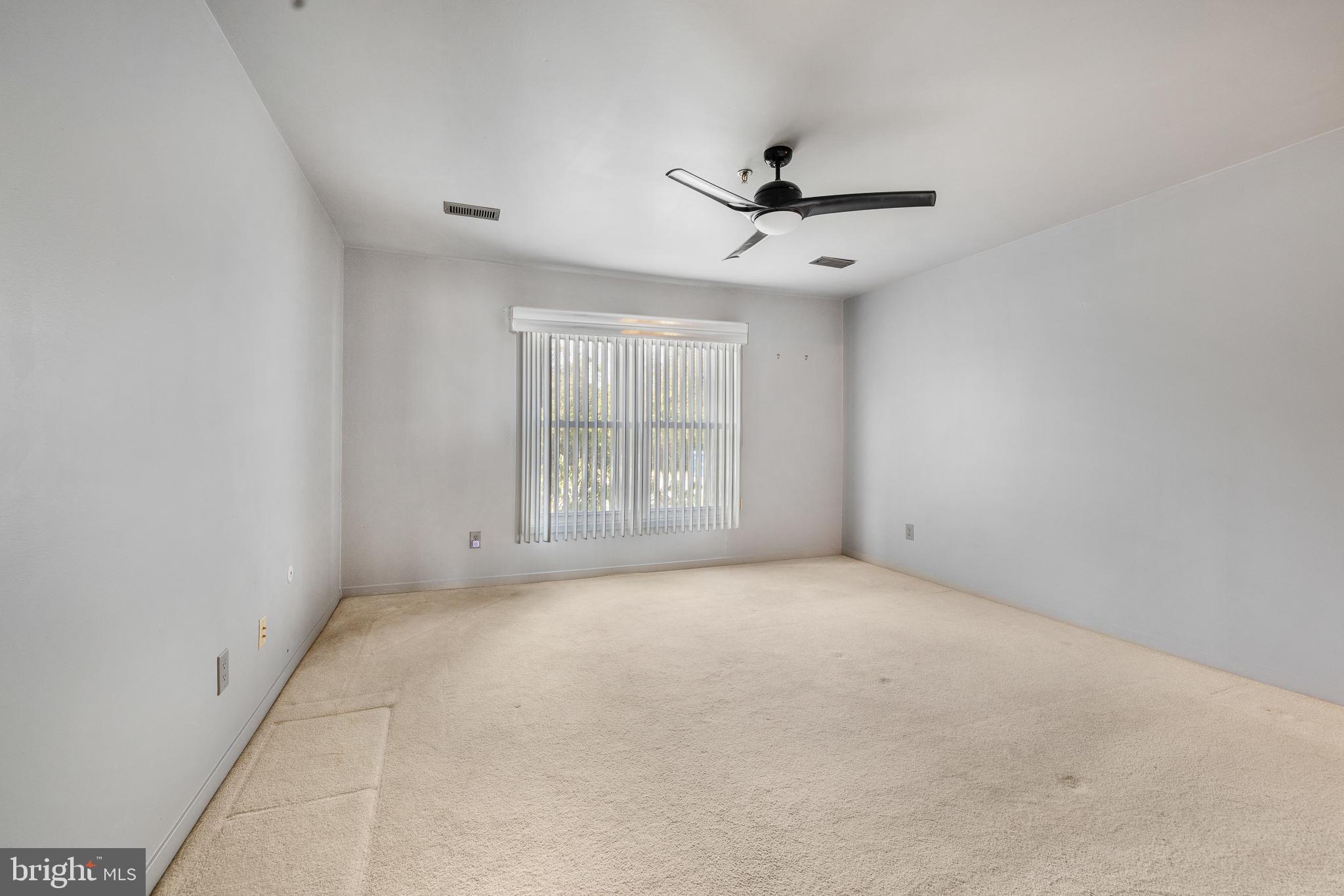 5213 Le Parc Drive, Unit 4 Wilmington, DE 19809 - Photo 30 of 37 an empty room with windows