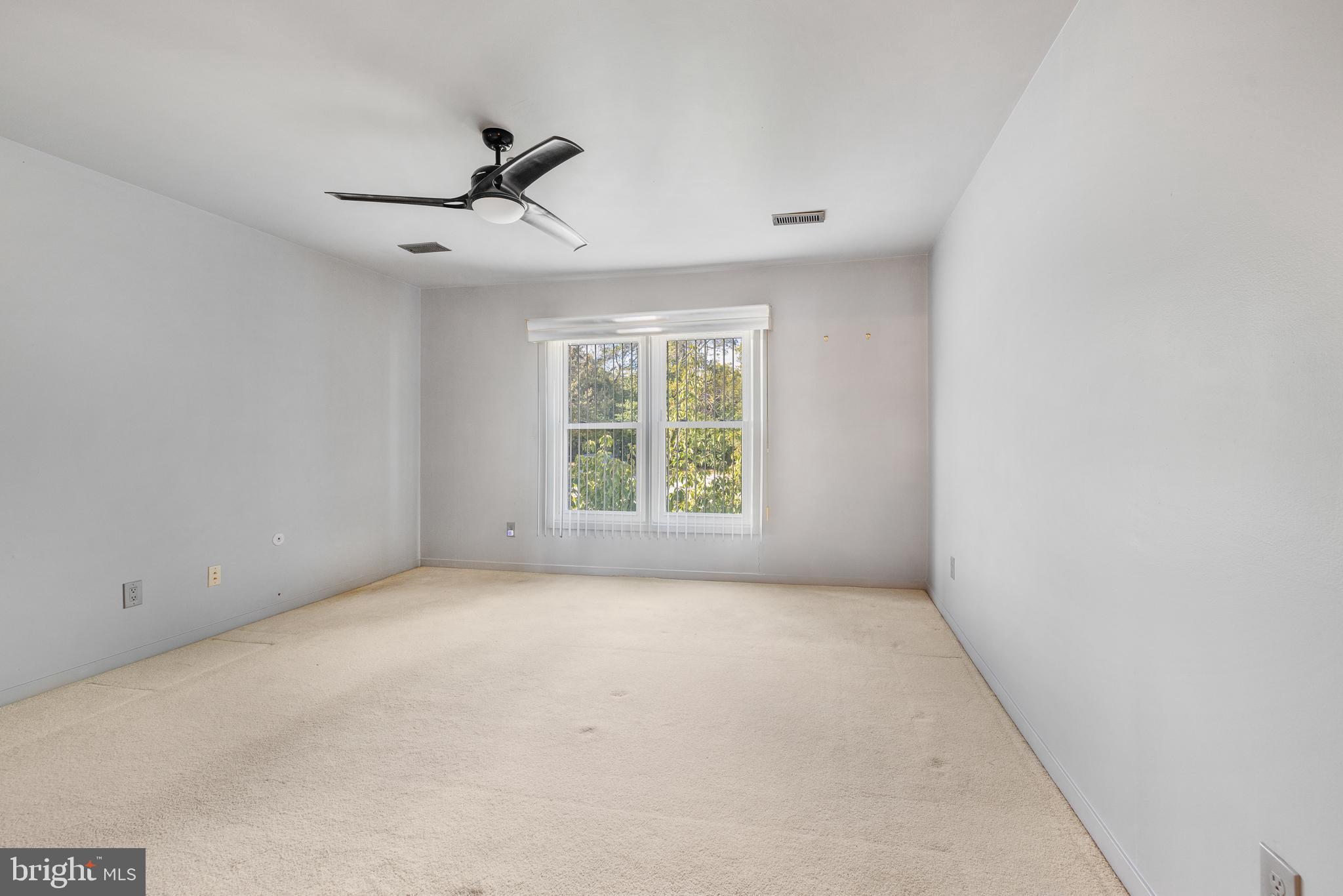 5213 Le Parc Drive, Unit 4 Wilmington, DE 19809 - Photo 31 of 37 an empty room with windows