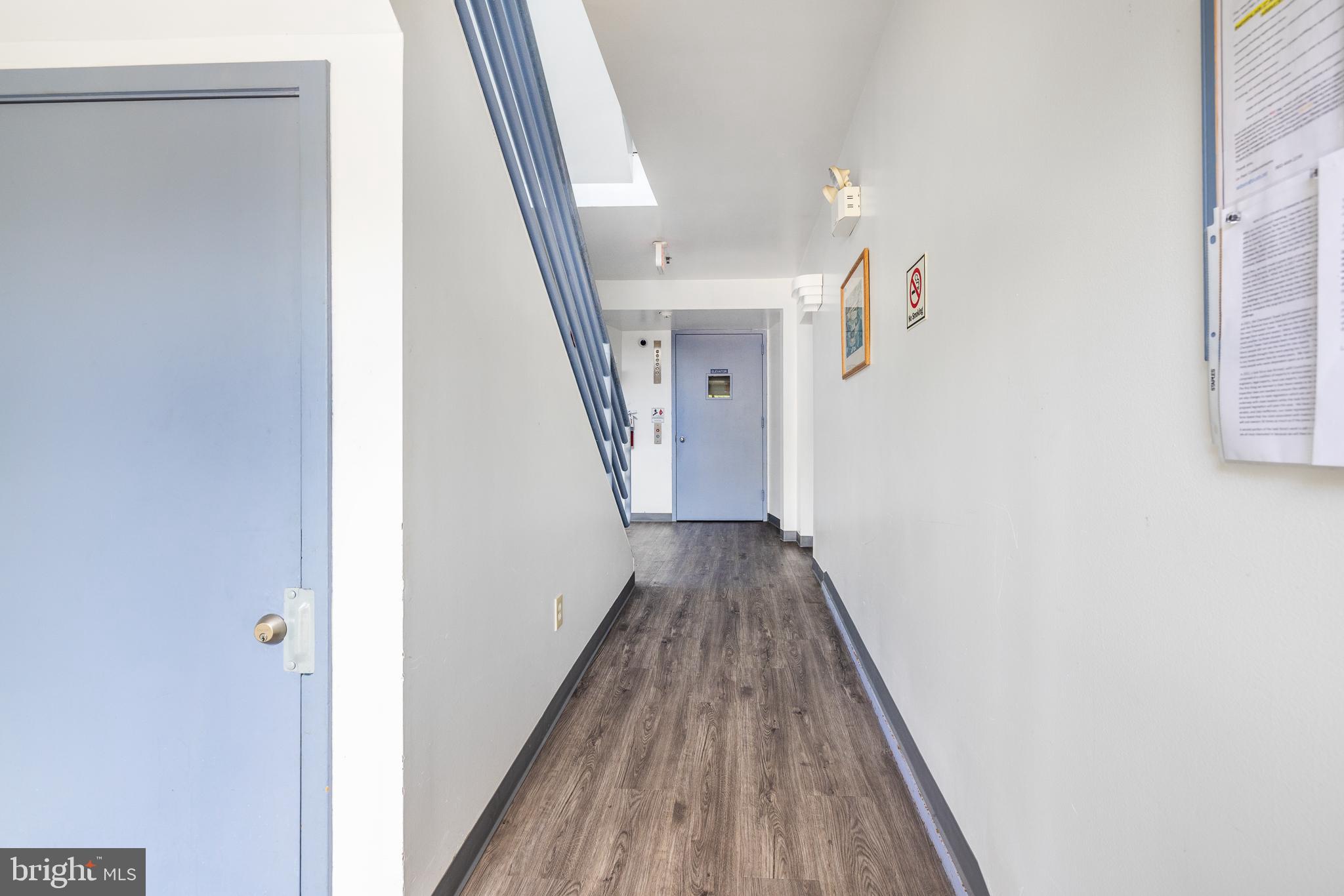 5213 Le Parc Drive, Unit 4 Wilmington, DE 19809 - Photo 37 of 37 a view of a hallway with wooden floor and staircase