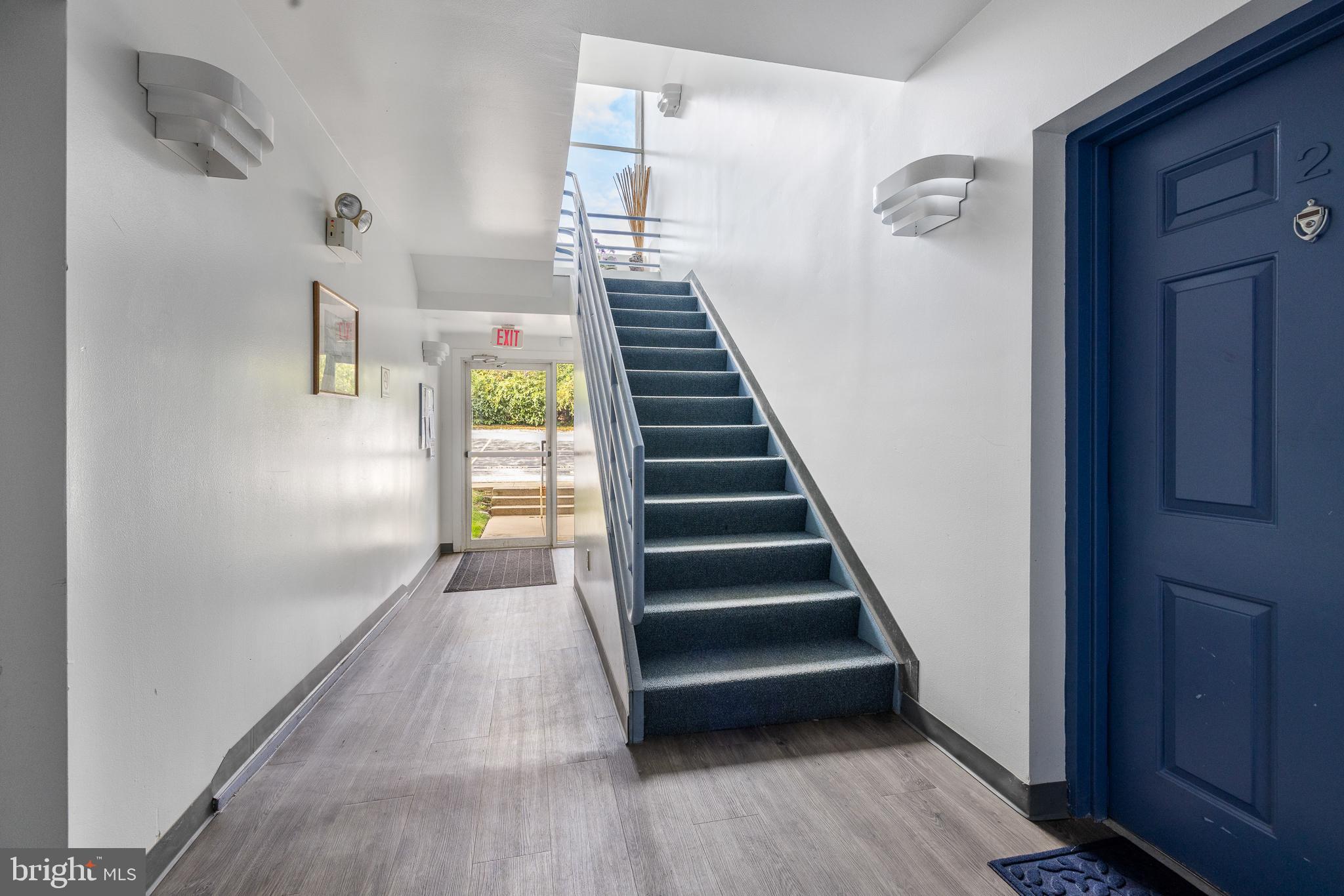 5213 Le Parc Drive, Unit 4 Wilmington, DE 19809 - Photo 10 of 37 a view of entryway and hall with wooden floor