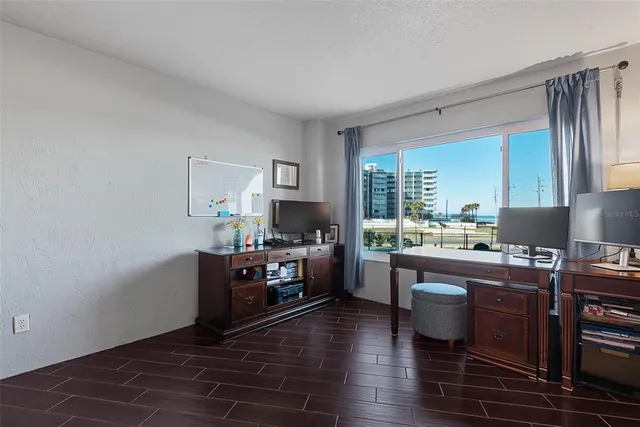 a room with a large window and a flat screen tv