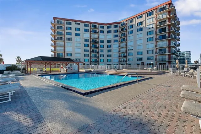 a view of a swimming pool with a chairs