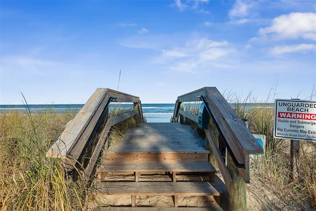 a view of a balcony with an ocean view