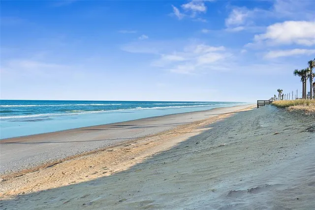 a view of a terrace with outdoor space and ocean view