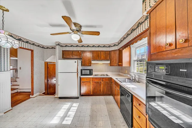 a storage room with wooden floor and white walls