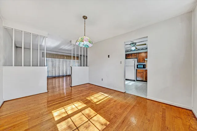 a kitchen with stainless steel appliances granite countertop a refrigerator and a stove