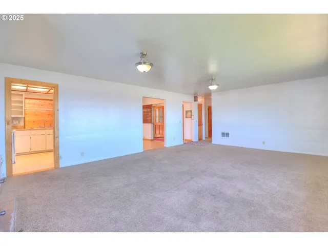 a kitchen with a sink cabinets and a window