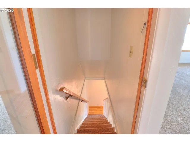 a view interior of a house wooden floor and an entryway