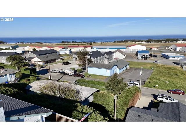 a aerial view of a house in a big yard