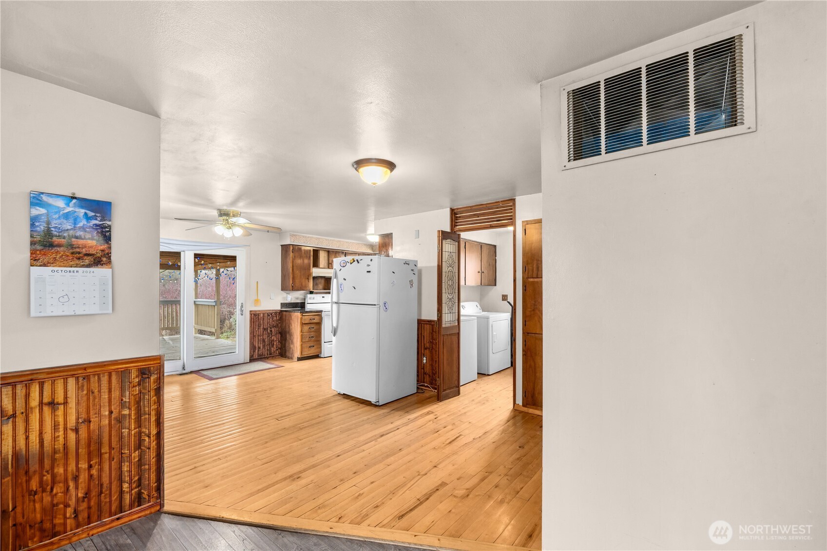 526 Greenwood Loop Road Kettle Falls, WA 99141 - Photo 20 of 35 a kitchen with refrigerator and wooden floor