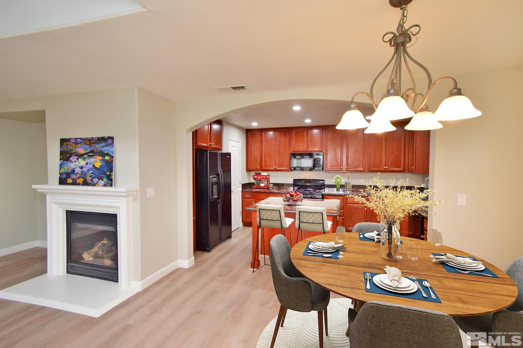 1689 Clover Hill Trail Reno, NV 89523 - Photo 1 of 32 a view of a dining room with furniture a chandelier and wooden floor