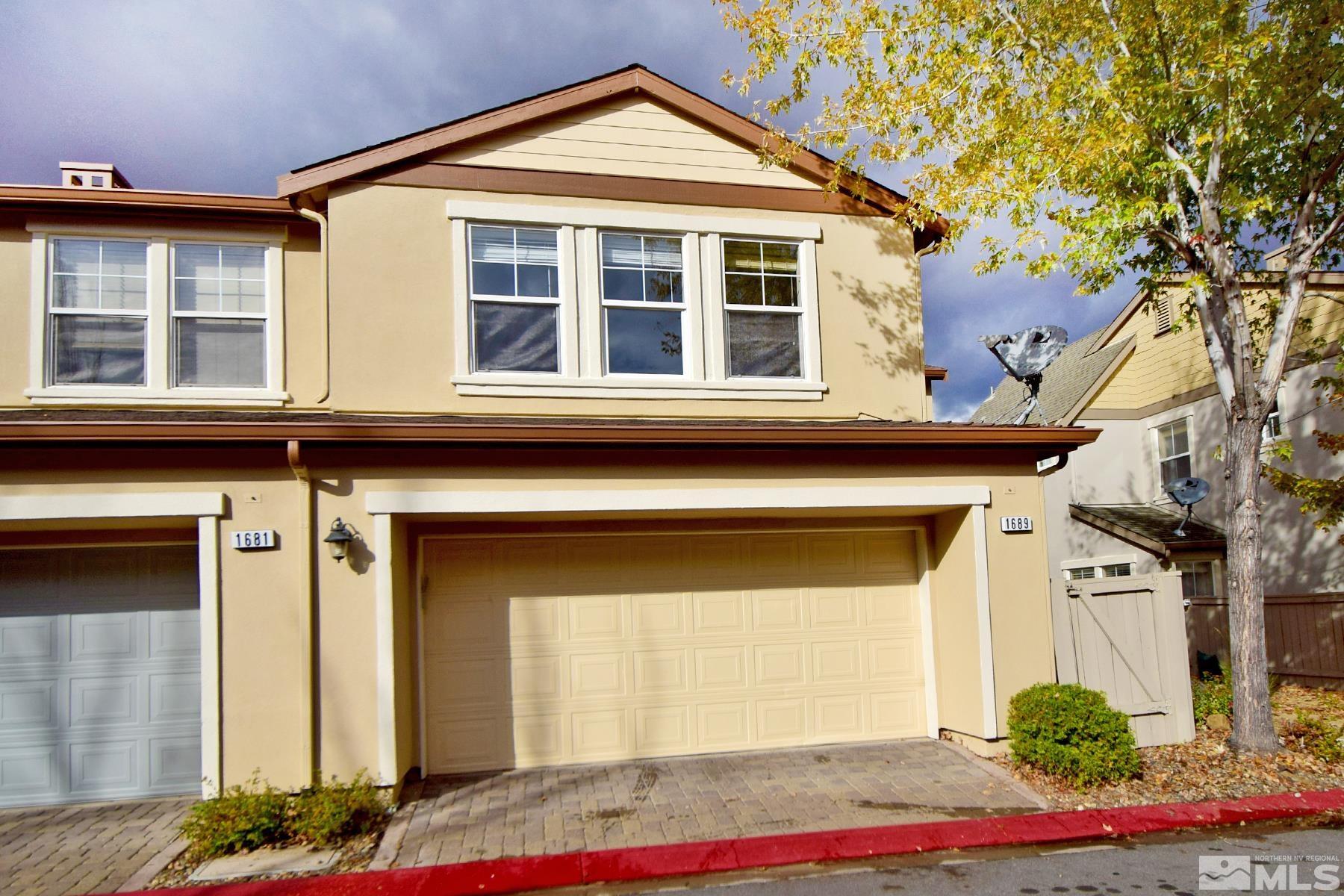 1689 Clover Hill Trail Reno, NV 89523 - Photo 23 of 32 a front view of a house with a yard