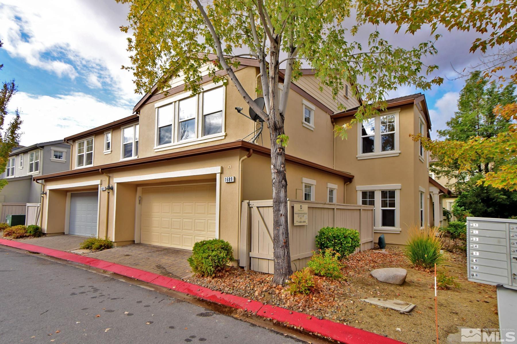 1689 Clover Hill Trail Reno, NV 89523 - Photo 24 of 32 a front view of a house with a yard
