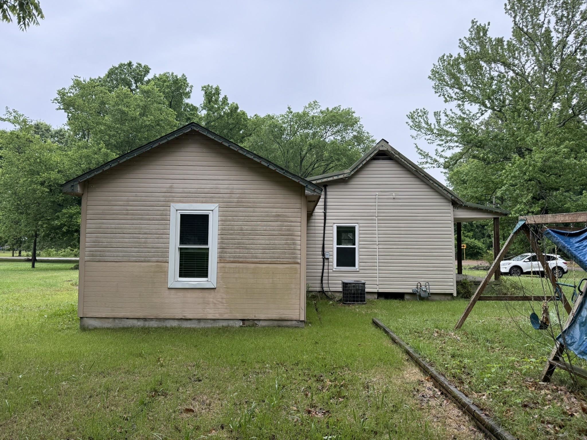 2102 Campbell Road Millington, TN 38053 - Photo 10 of 18 Property exterior featuring horizontal siding and multiple windows