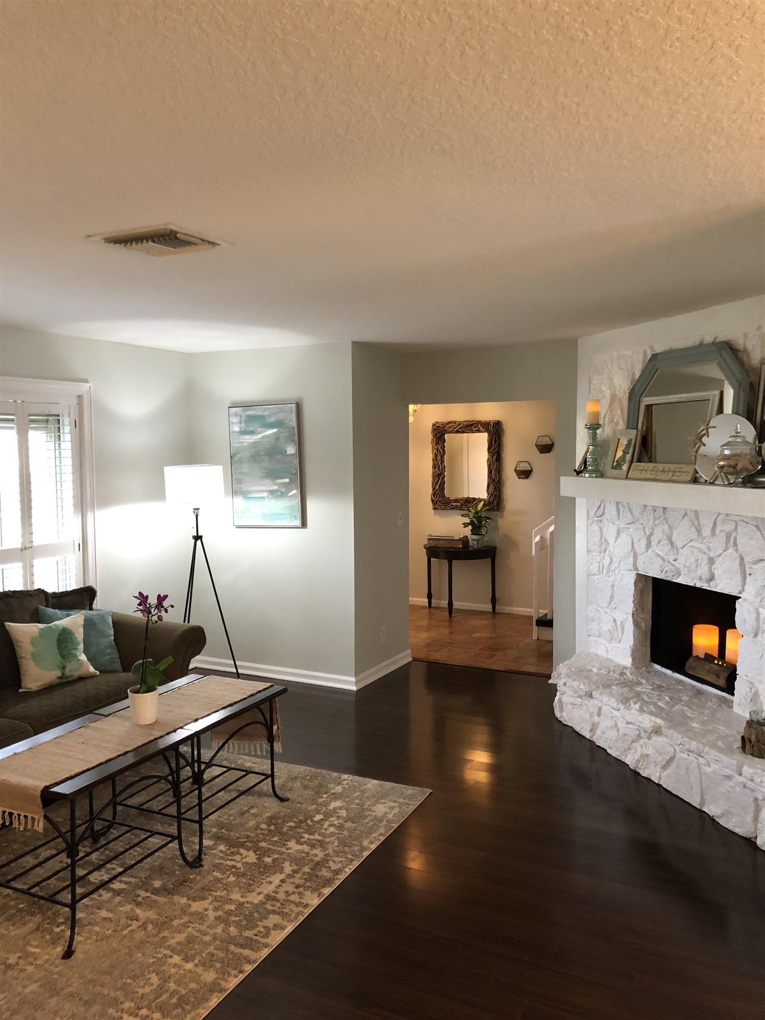 67 Fairview West Tequesta, FL 33469 - Photo 11 of 25 a living room with furniture and a fireplace