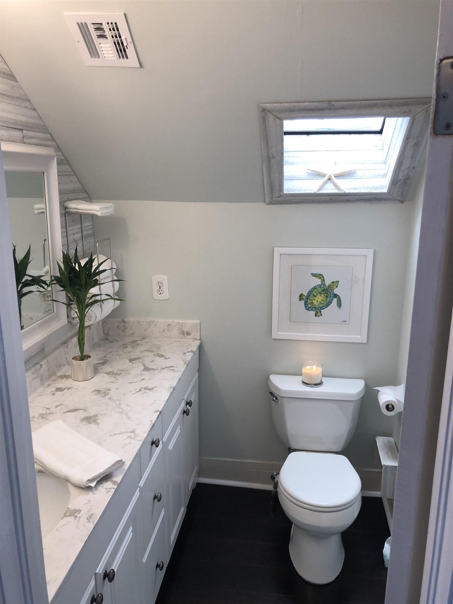 67 Fairview West Tequesta, FL 33469 - Photo 18 of 25 a bathroom with a granite countertop toilet sink and mirror