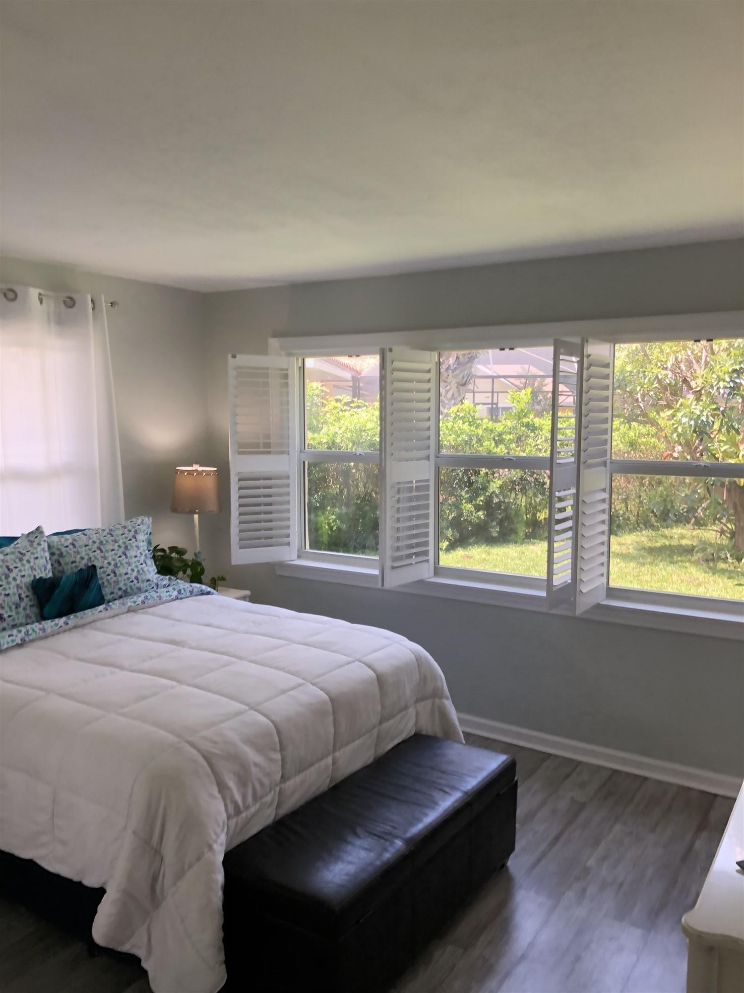 67 Fairview West Tequesta, FL 33469 - Photo 19 of 25 a bedroom with a bed and window