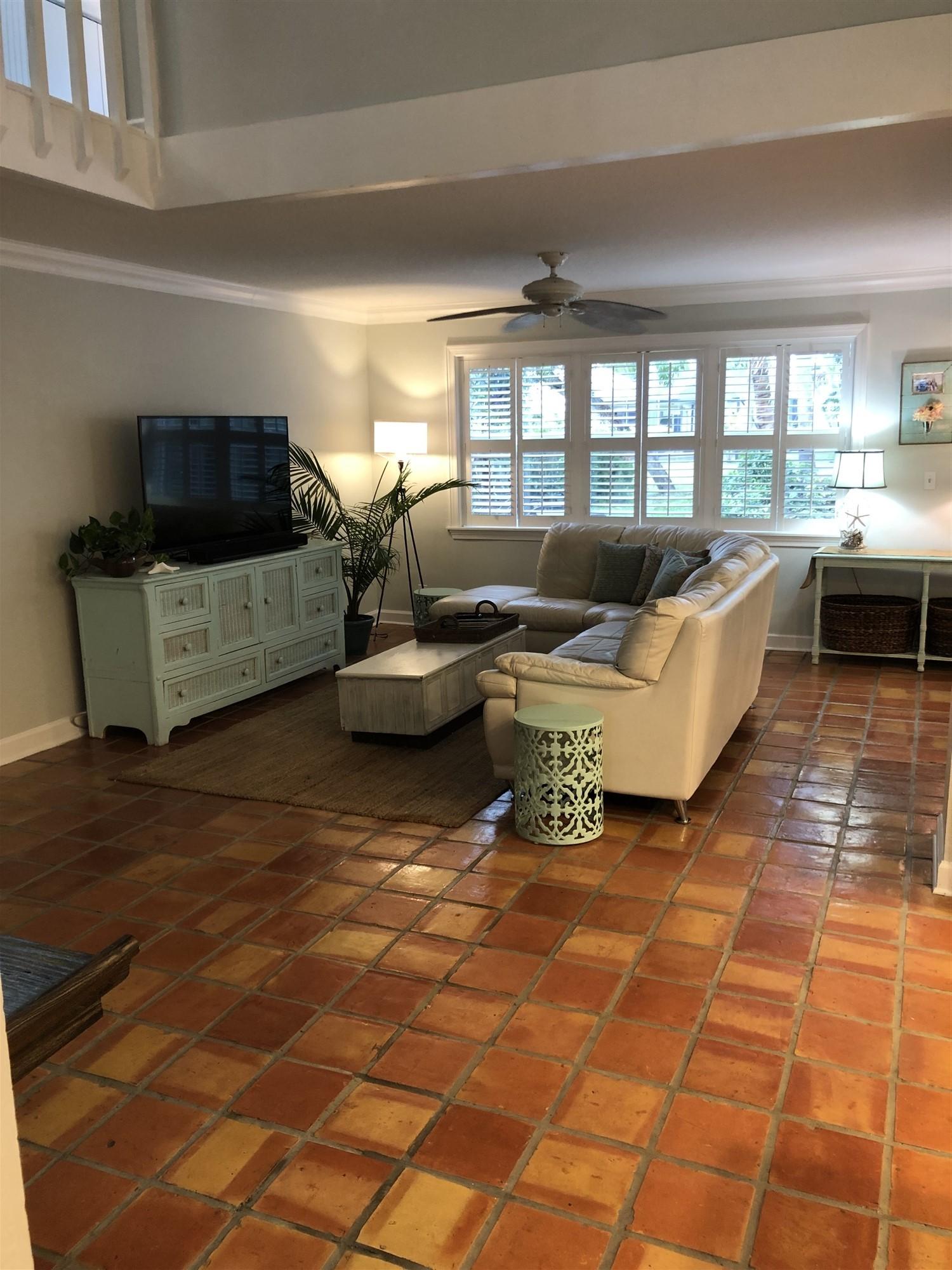 67 Fairview West Tequesta, FL 33469 - Photo 20 of 25 a living room with furniture and a flat screen tv