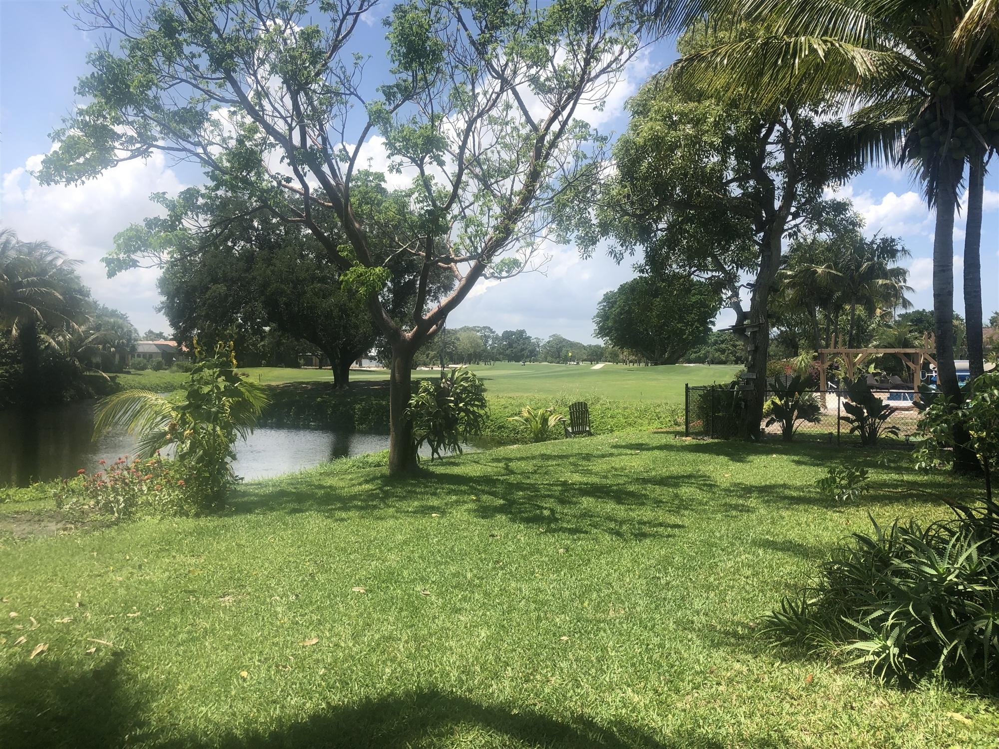 67 Fairview West Tequesta, FL 33469 - Photo 5 of 25 a view of a park that has large trees