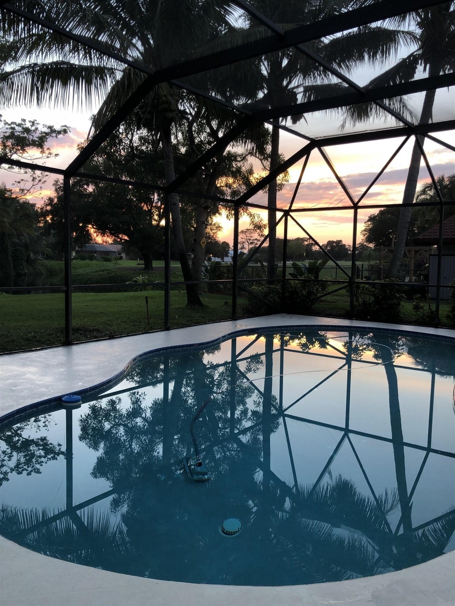 67 Fairview West Tequesta, FL 33469 - Photo 7 of 25 a view of swimming pool with a yard