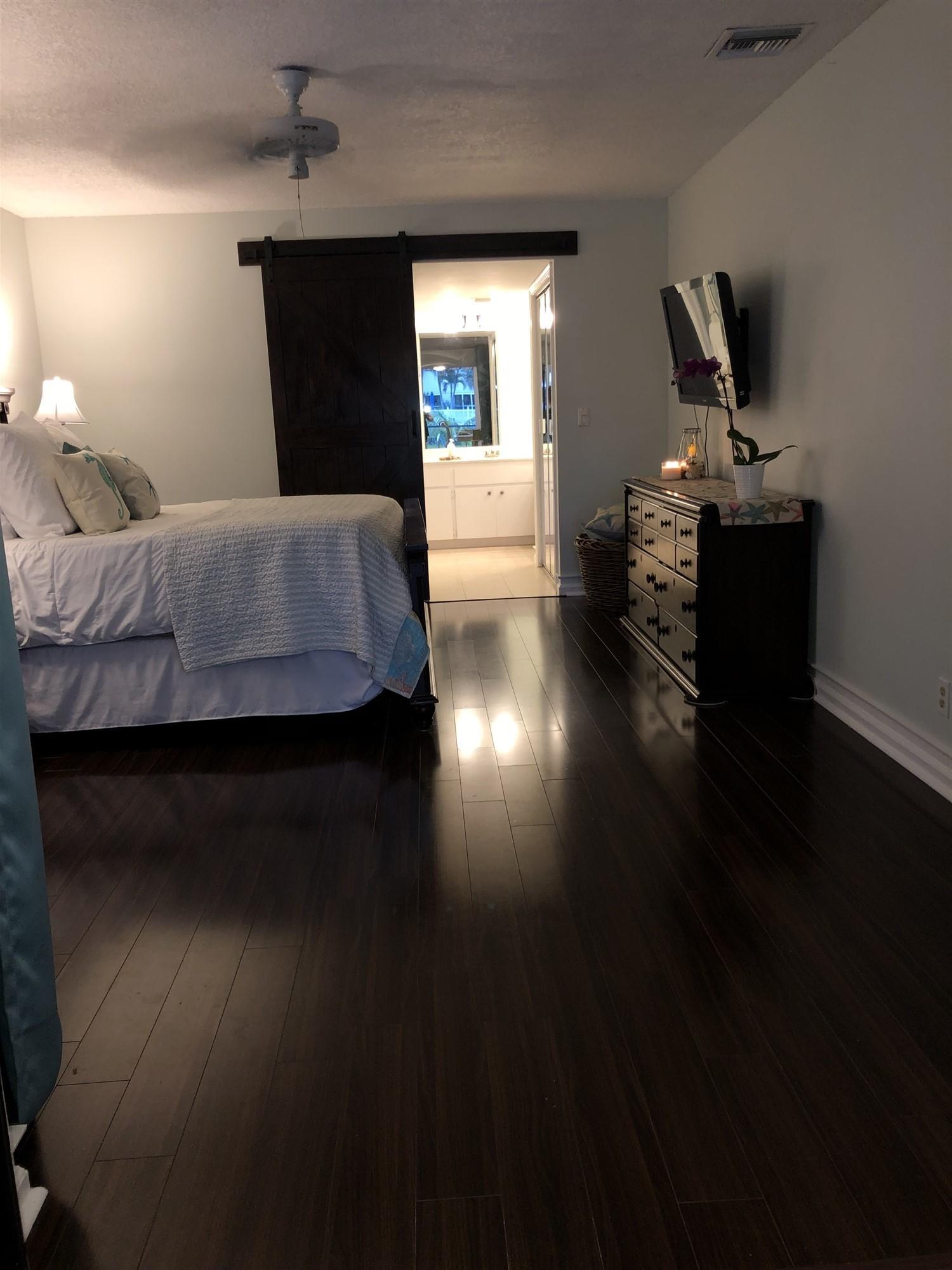 67 Fairview West Tequesta, FL 33469 - Photo 8 of 25 a bedroom with bed and window