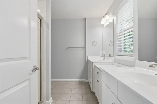 a bathroom with a double vanity sink mirror and double