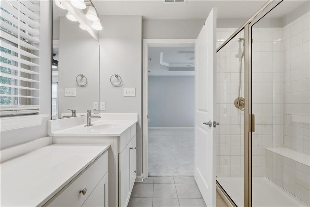 141 Arbor Trail Drive McKees Rocks, PA 15136 - Photo 27 of 44 a bathroom with a shower sink vanity and mirror
