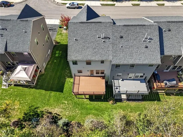 an aerial view of a house with a garden and plants